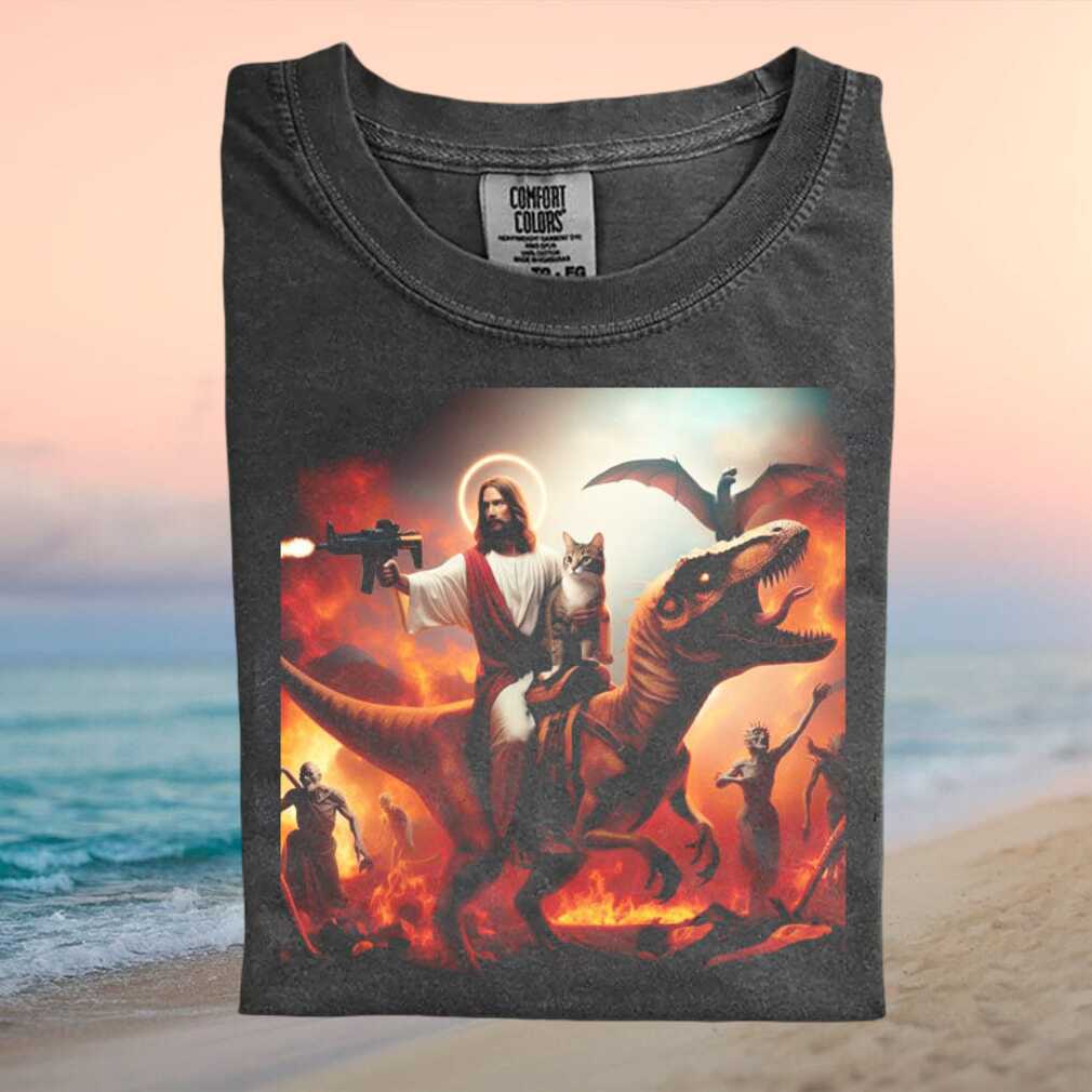 Jesus Riding Dinosaur With Cat Fire Hell Meme Graphic T Shirt - Limotees LLC